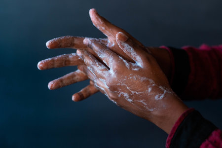 A closeup shot of the soaped hands of a person - importance of washing hands during the coronavirus...