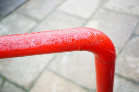 A closeup shot of a red metal over the groundの写真素材
