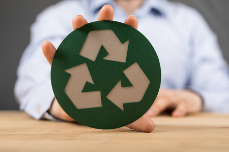 A man showing the symbol of the ecological friendly concept
