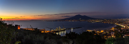 A panoramic view of Mount Vesuvius and Gulf of Naples during sunset in Italyの写真素材