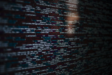 A closeup shot of a screen with HTML JavaScript source code for web page development data