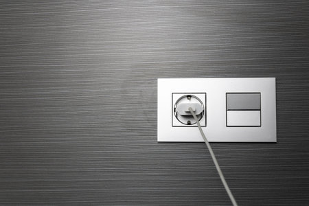 A closeup shot of a switch panel and plug point