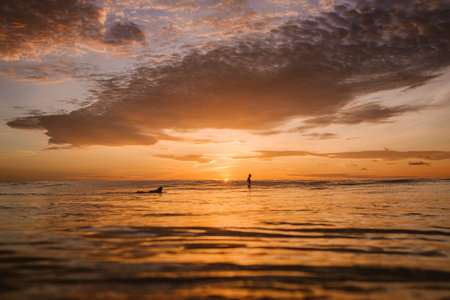 The mesmerizing view of the colorful dawn over the calm ocean in Mentawai islands, Indonesia