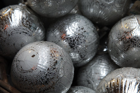 A closeup shot of the silver baubles of a Christmas treeの写真素材