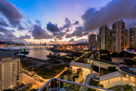 The modern city with houses and buildings during the sunsetの写真素材