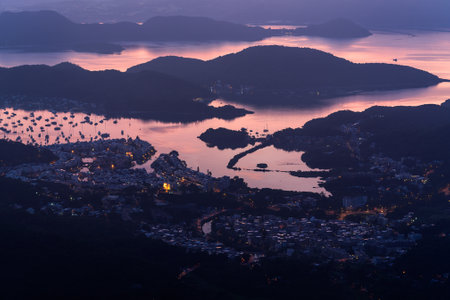 A high angle shot of the harbor by the sea captured in the beautiful colors of the twilightの写真素材