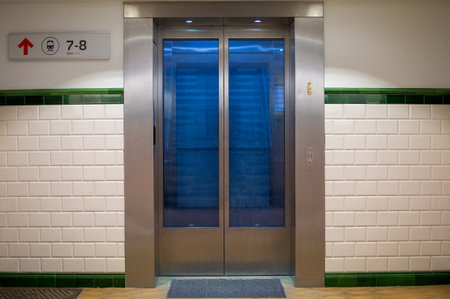 An amazing view of an elevator with blue reflecting doors