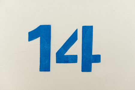 The number fourteen painted on white background with blue paint