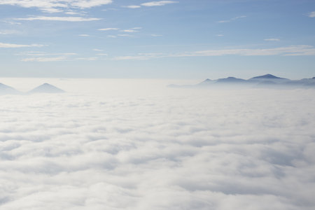 A beautiful view of sea of clouds with mountain topsの写真素材