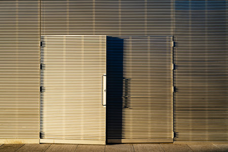 A closeup of a partial open double doorの写真素材