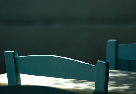 Detail of traditional Greek taverna chairs.  A simple view that abstracts the subject and provides a bokeh background with copy space.の写真素材