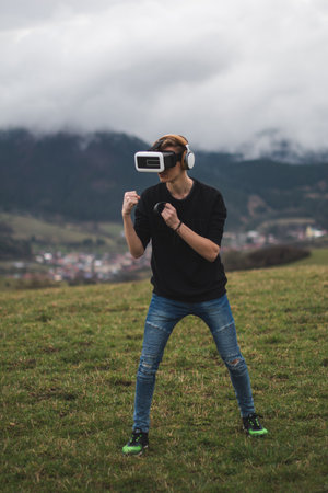 Teenager Lost in a Digital World - Virtual Reality, Futuristic Modern Recreation Technology Concept - Playing Games in Futureの写真素材