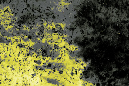 A closeup of a yellow and grey painted rough surface - perfect for an abstract backgroundの写真素材