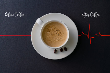 A closeup shot of a cup of coffee with a red heartbeat cardiogram with "before coffee" and "after coffee" writingsの写真素材