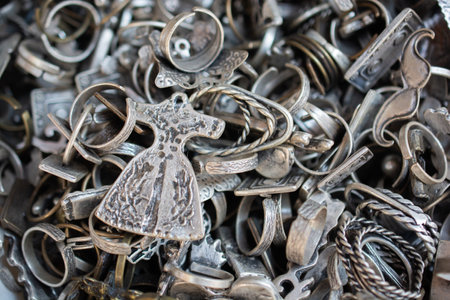 A high angle closeup shot of different silver accessoriesの写真素材