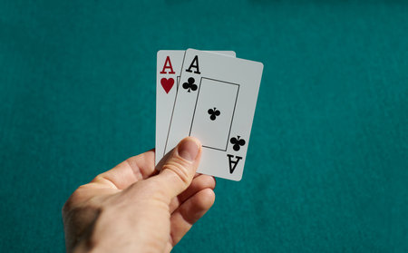 A closeup shot of playing cards held in a human handの写真素材