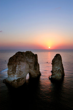 A beautiful vertical shot of Pigeons' Rock Beirut Lebanon and the sunset over the sea