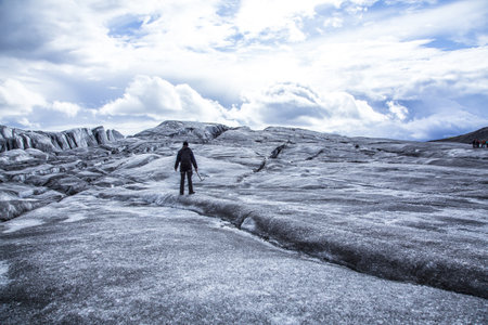 A young man doing the glacier trekking in Iceland
