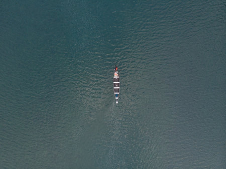 An aerial shot of a boat in the Spiti river, Indiaの写真素材