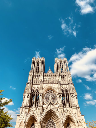 A vertical low angle shot of the beautiful Reims Cathedral located in Reims, France