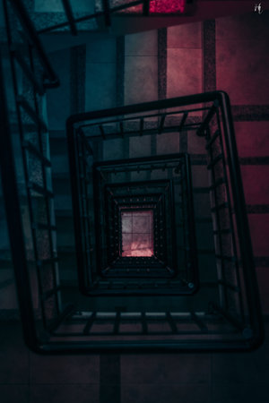 A vertical high angle shot of a staircase leading to an unknown placeの写真素材