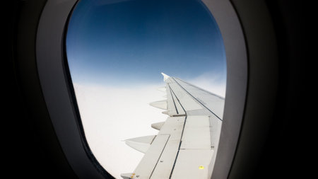 A breathtaking view of the blue  sky from an airplane window