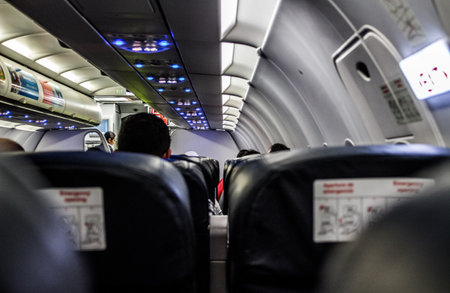 A shot of passengers inside an airplane during the flight