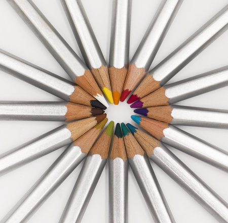 A high angle shot of artistic shapes made of colorful pencils with silver coveringの写真素材