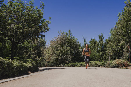 A young athlete female training on the road