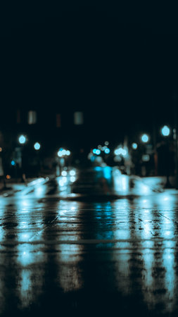 A vertical shot of blurred lights at night in the alley -perfect for backgroundの写真素材