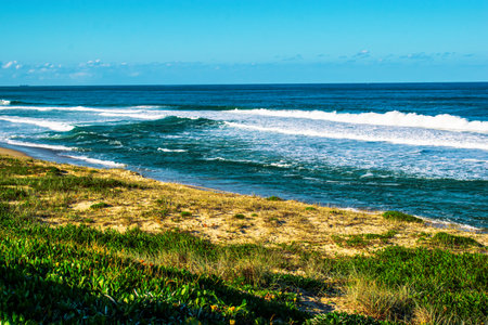 A beautiful shot of a wavy sea under blue sky