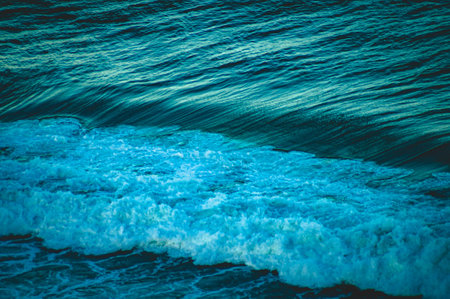 A beautiful close up shot of vibrant blue ocean wavesの写真素材