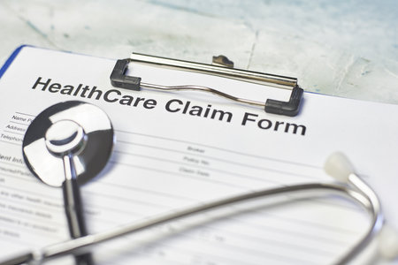 The healthcare claim form and a stethoscopeの写真素材