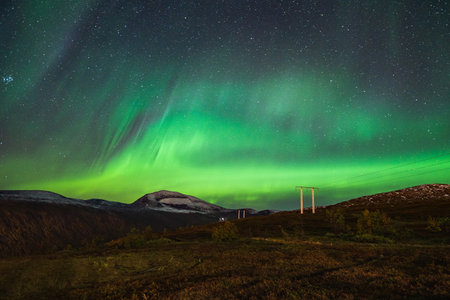 A beautiful scenery of Aurora borealis in the night sky of Tromso Lofoten Islands, Norway