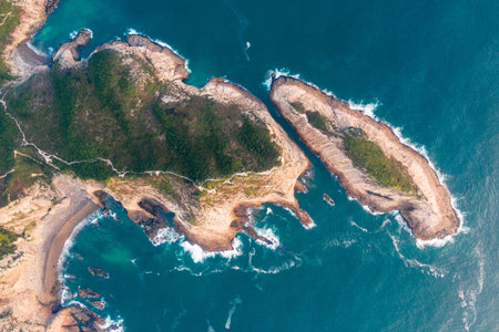 An aerial shot of the mesmerizing cliff along the oceanの写真素材