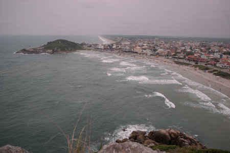 A city coastline at Sao Francisco Do Sul in Santa Catarina, Brazil under a cloudy skyの写真素材