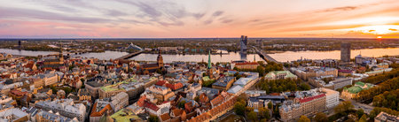A panoramic aerial view of Riga, Latvia during sunset