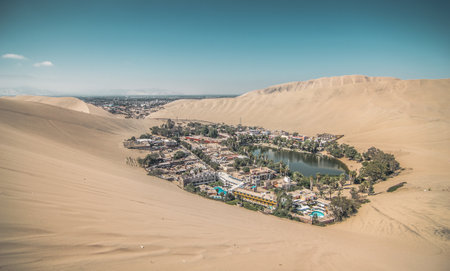 A scenic view of Huacachina and surrounding dunes - perfect for wallpaperの写真素材