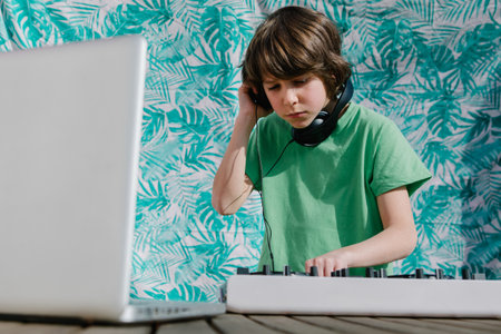 A young American boy near the DJ controller - the concept of DJingの写真素材