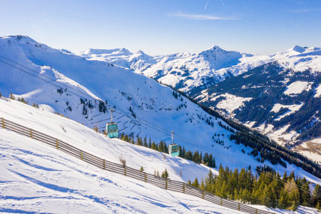 A beautiful shot of a ropeway in high snowy mountains