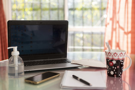 A closeup shot of the essentials things during an online class amidst the COVID19 pandemicの写真素材