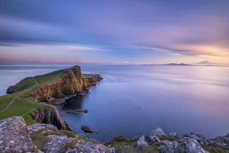 Neist Point lighthouse at distance, Isle of Skye.の写真素材