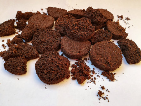 A closeup of used coffee grounds under the lights on a white backgroundの写真素材