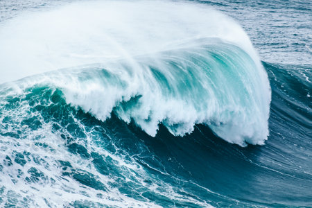 A closeup shot of a beautiful blue sea wave in NazarÃ©, Portugal