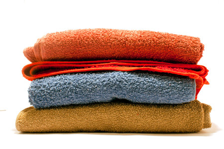 A closeup shot of colorful bathing towels isolated on a white backgroundの写真素材