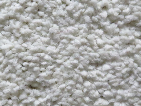 A closeup shot of white soft fluffy carpet texture detailsの写真素材