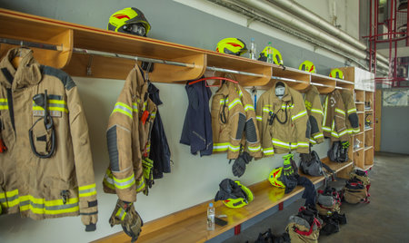 A dressing room with hanging uniformsの写真素材