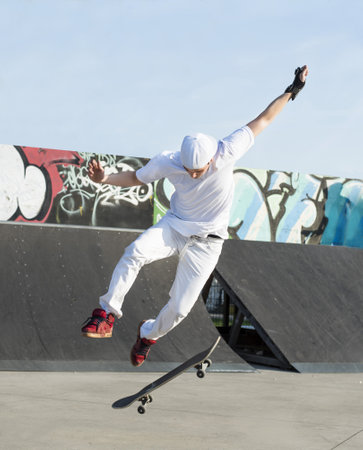A shallow focus shot of a young boy skateboarding in the skateboarding areaの写真素材