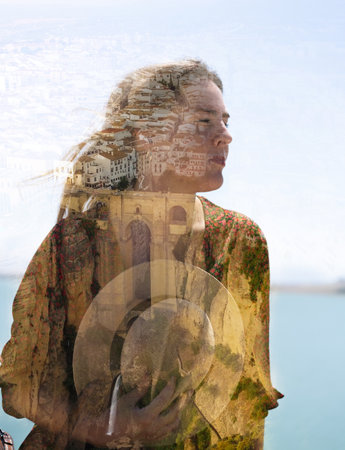 A double exposure portrait of a young caucasian female combined with historical buildings - a concept of the unity of human with homelandの写真素材