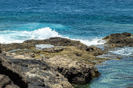 A mesmerizing view of a beautiful seascape and rocks at daytime
